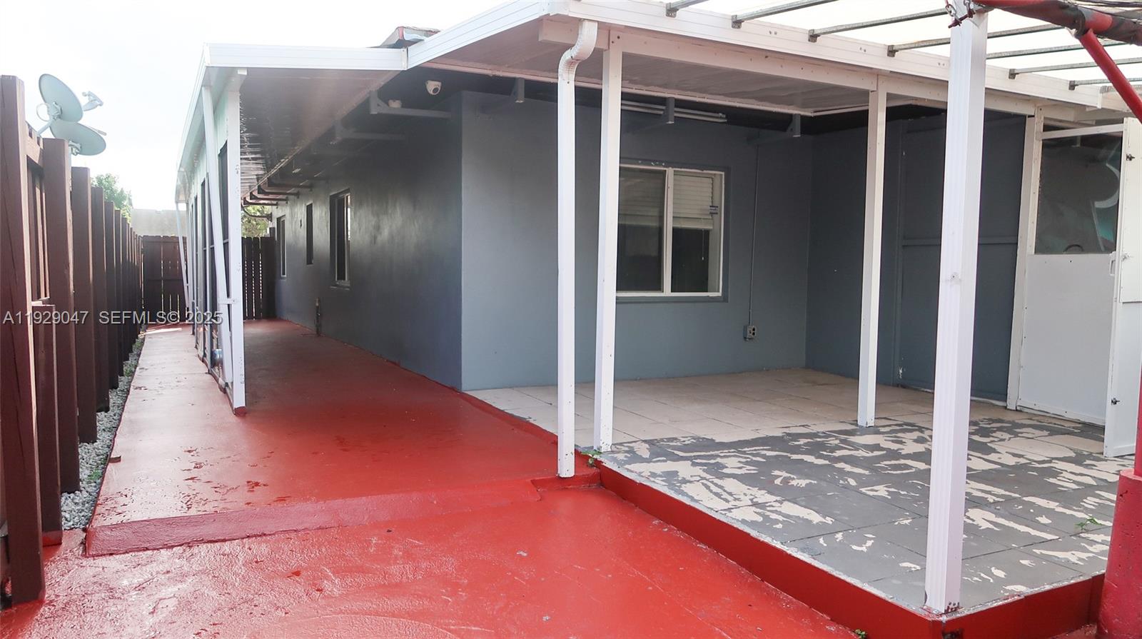 3109 Northwest 64th Street Miami, FL 33147 - Photo 25 of 38 a view of a hallway with a glass door