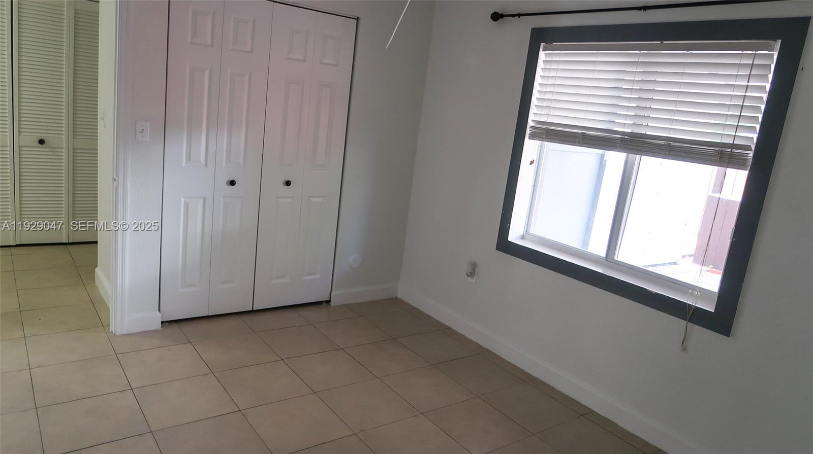 3109 Northwest 64th Street Miami, FL 33147 - Photo 37 of 38 a view of empty room with window