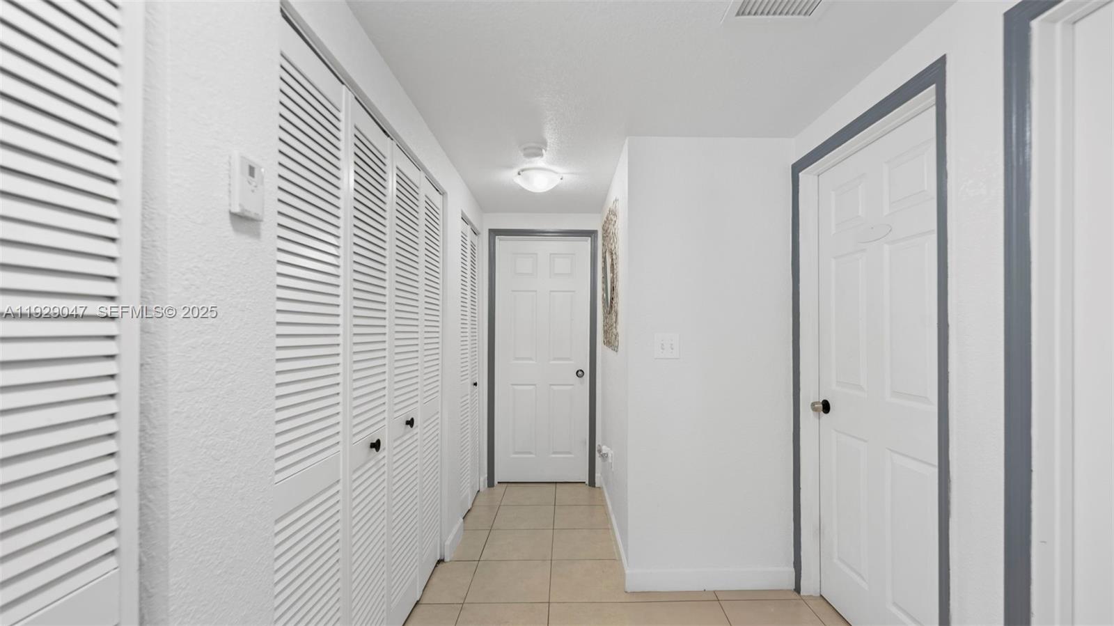 3109 Northwest 64th Street Miami, FL 33147 - Photo 6 of 38 a view of a hallway with a door