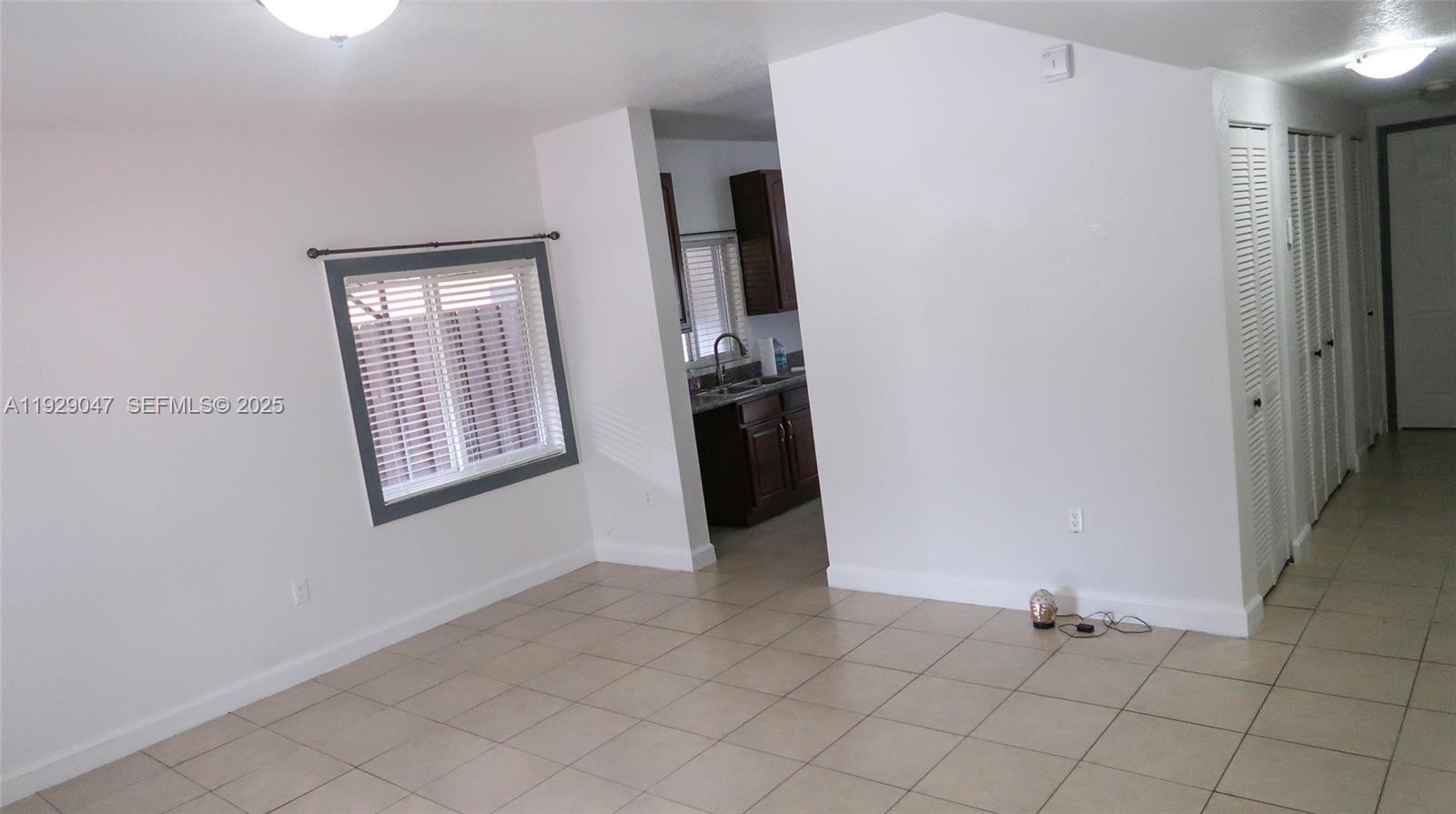 3109 Northwest 64th Street Miami, FL 33147 - Photo 7 of 38 an entryway with a window and fire place