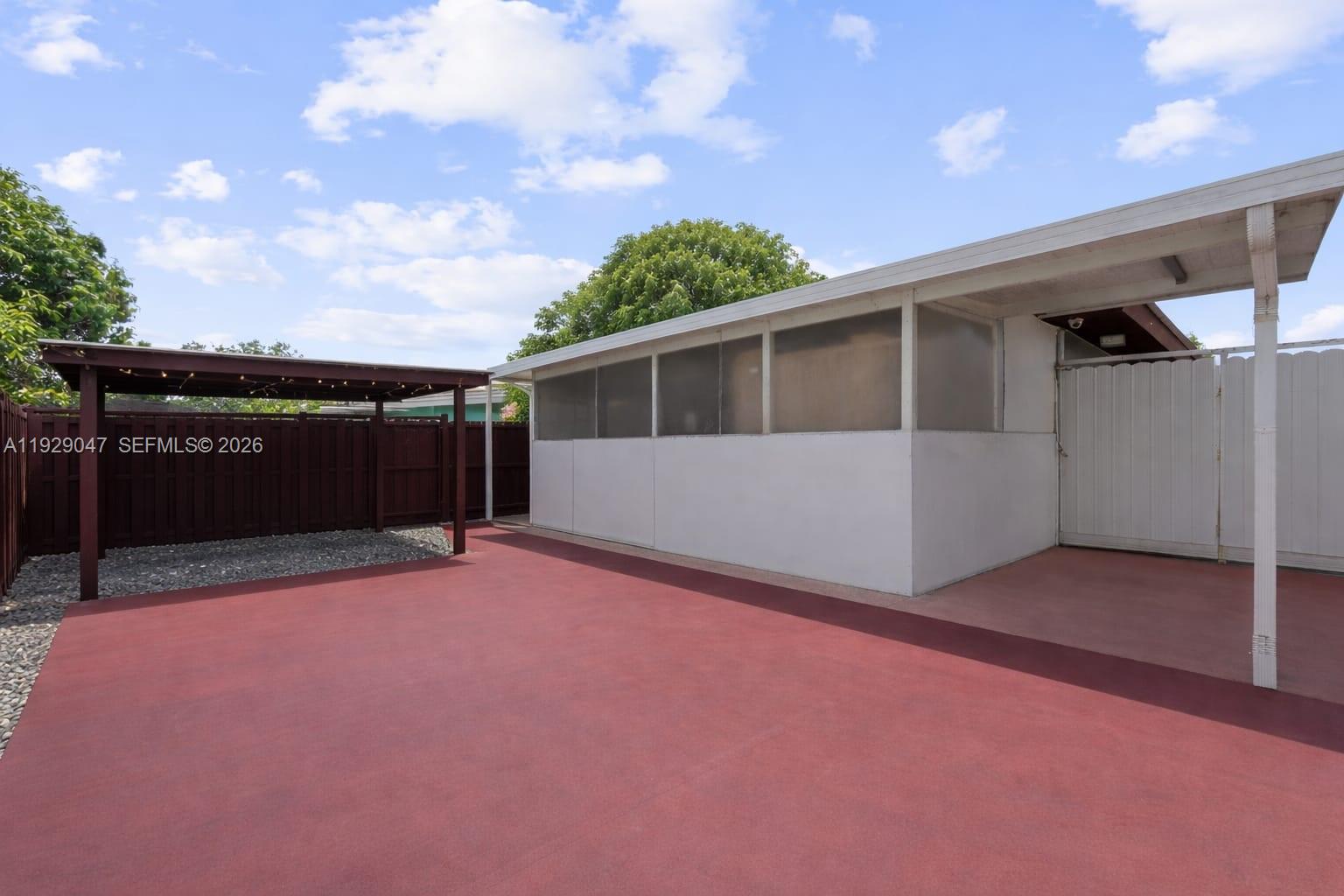 3109 Northwest 64th Street Miami, FL 33147 - Photo 10 of 20 a front view of a house with a yard and garage