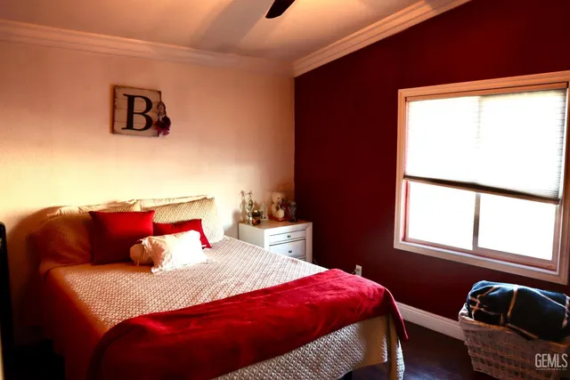 a bedroom with a bed and window