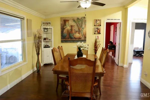 a view of a dining room with furniture and wooden floor