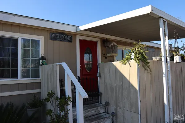 a view of a house with a small yard