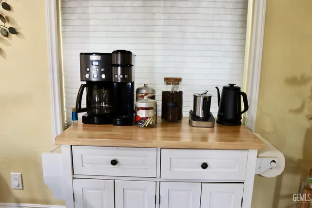 a view of kitchen island with stainless steel appliances