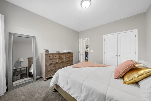 a bedroom with a bed and a cabinets