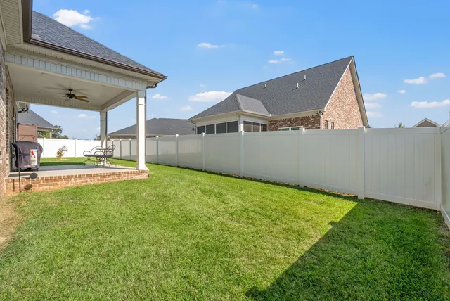 a view of a backyard of the house