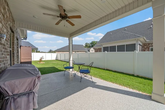 a view of a house with a yard and pathway