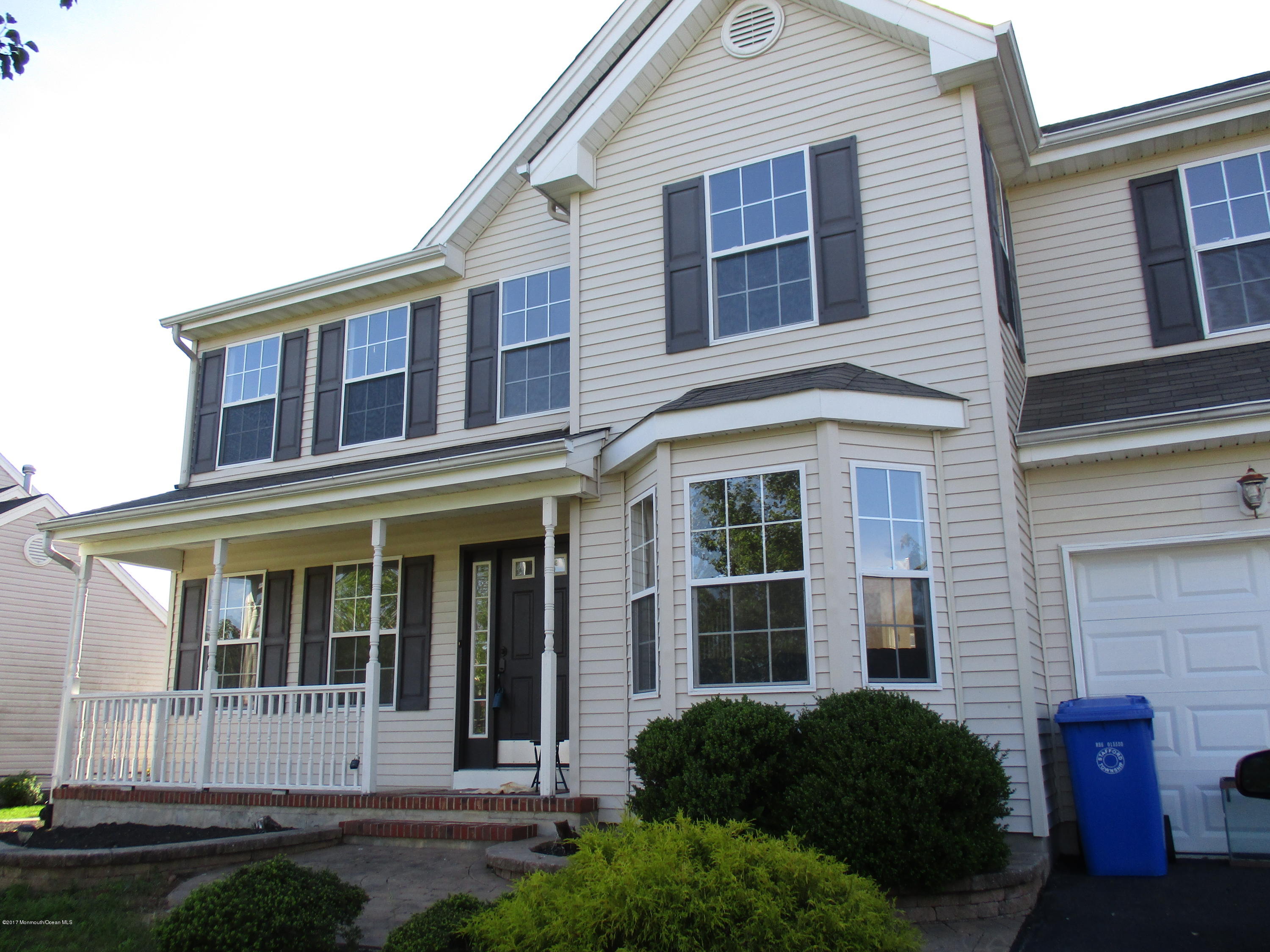 152 Barracuda Road Manahawkin, NJ 08050 - Photo 1 of 30 a view of a brick house with yard and plants