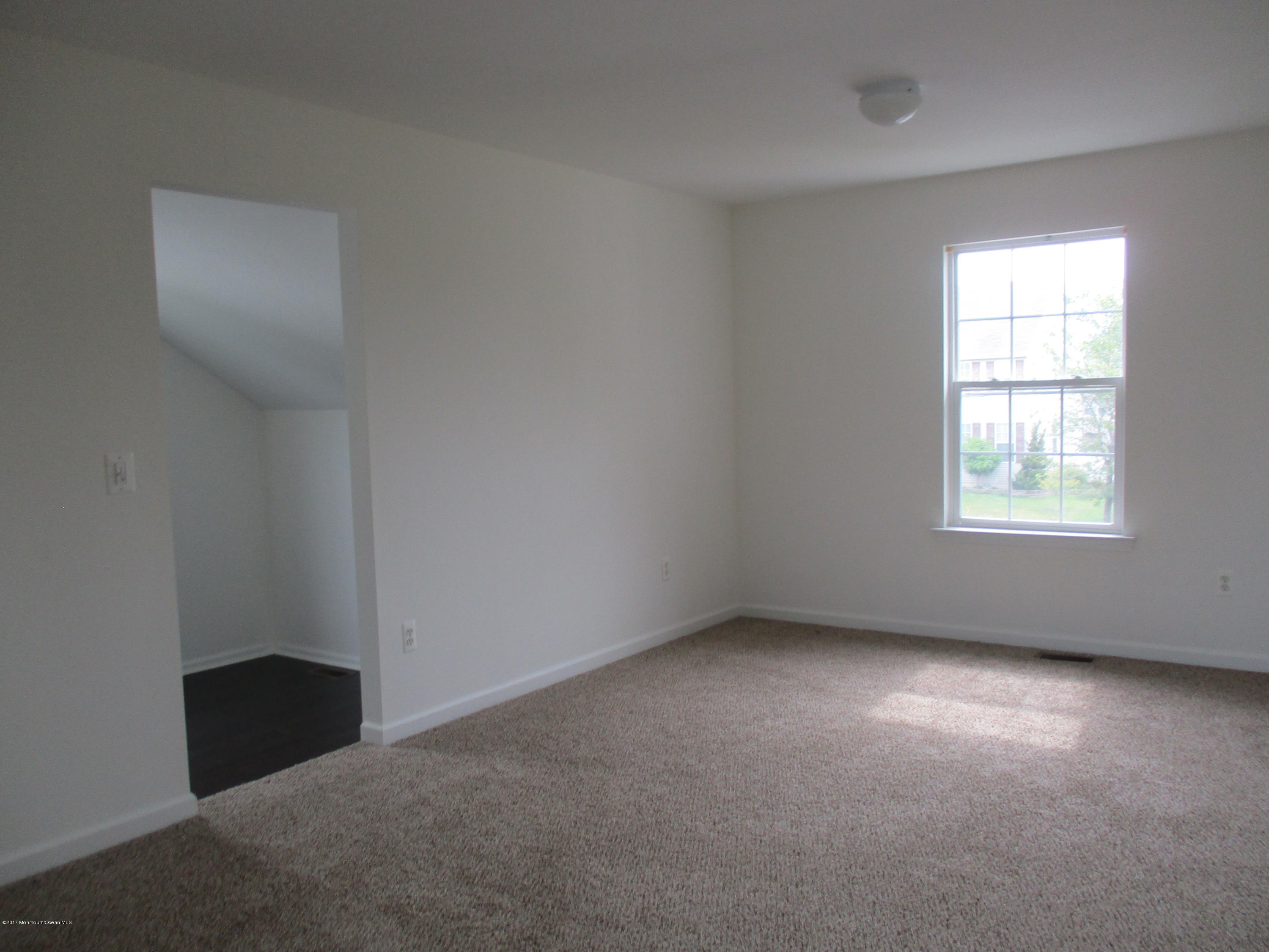 152 Barracuda Road Manahawkin, NJ 08050 - Photo 15 of 30 an empty room with a window