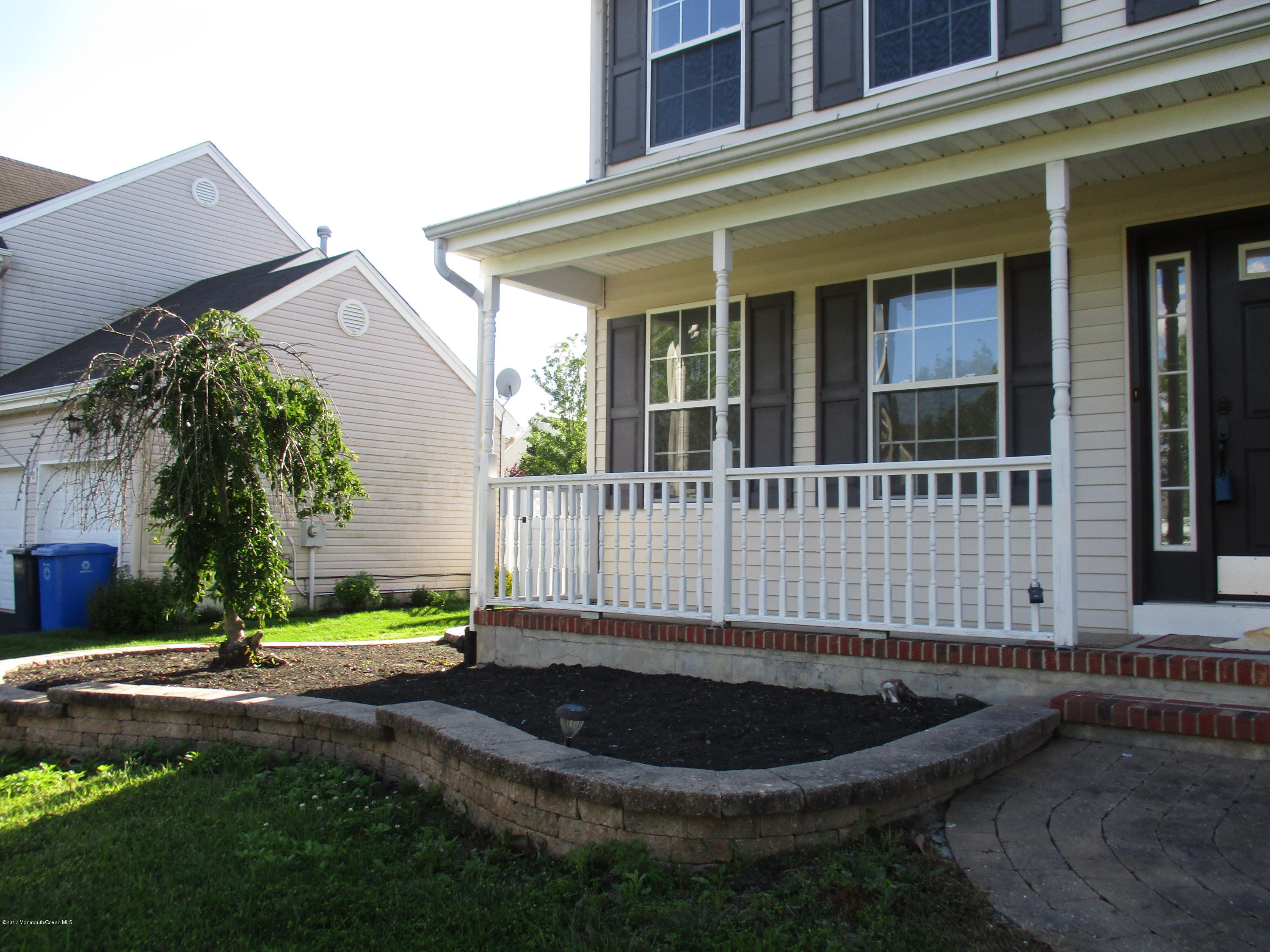 152 Barracuda Road Manahawkin, NJ 08050 - Photo 26 of 30 a view of a house with a small yard and sitting area