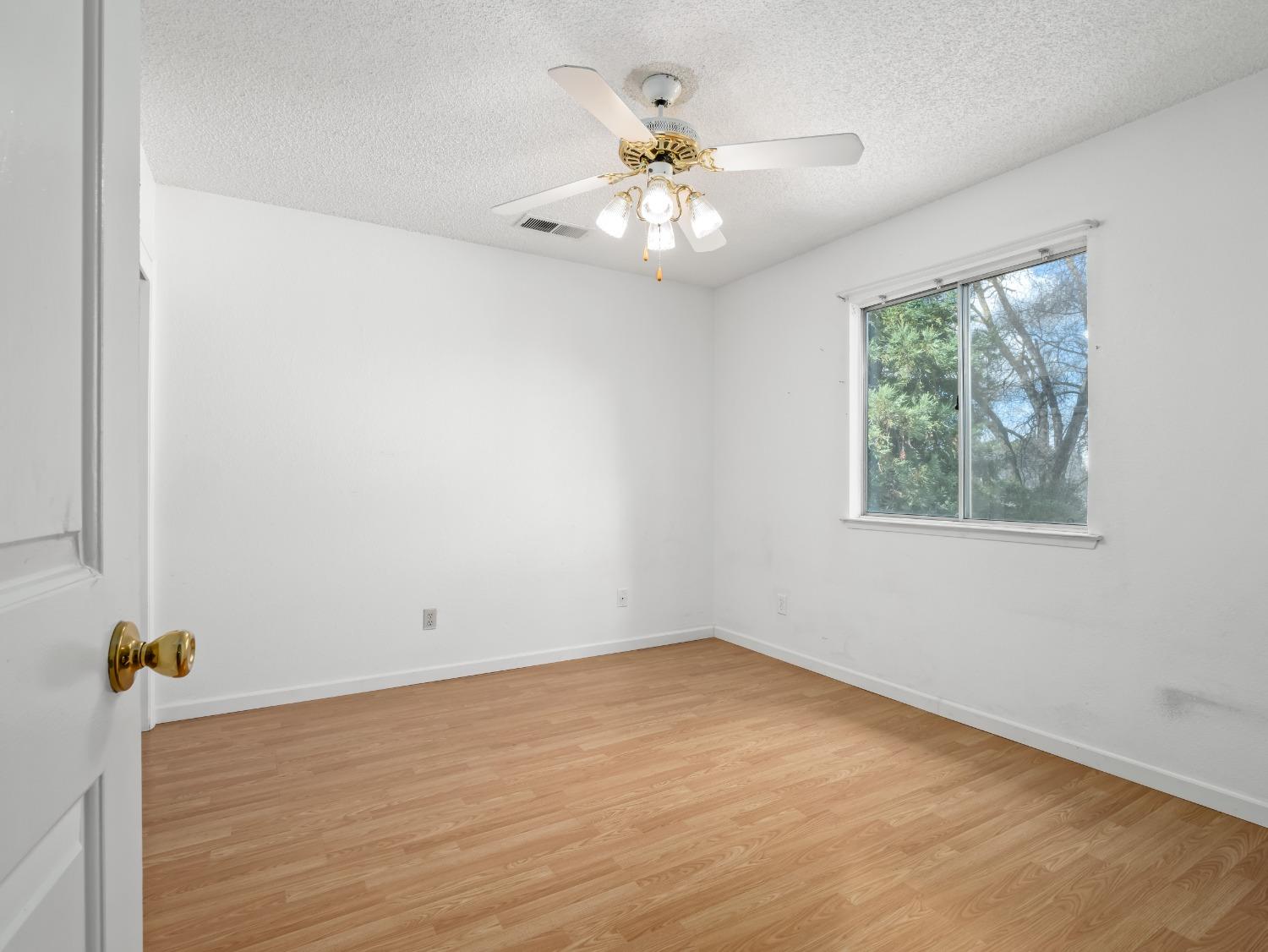 272 North Caesar Avenue Clovis, CA 93612 - Photo 16 of 34 wooden floor in an empty room with a window