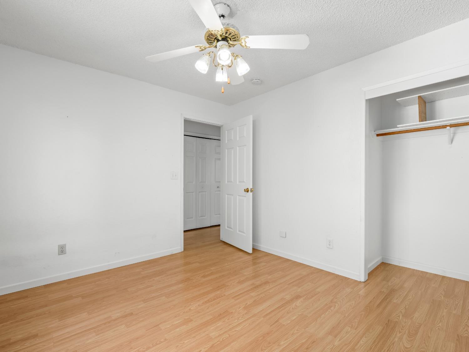 272 North Caesar Avenue Clovis, CA 93612 - Photo 17 of 34 a view of an empty room with a chandelier fan
