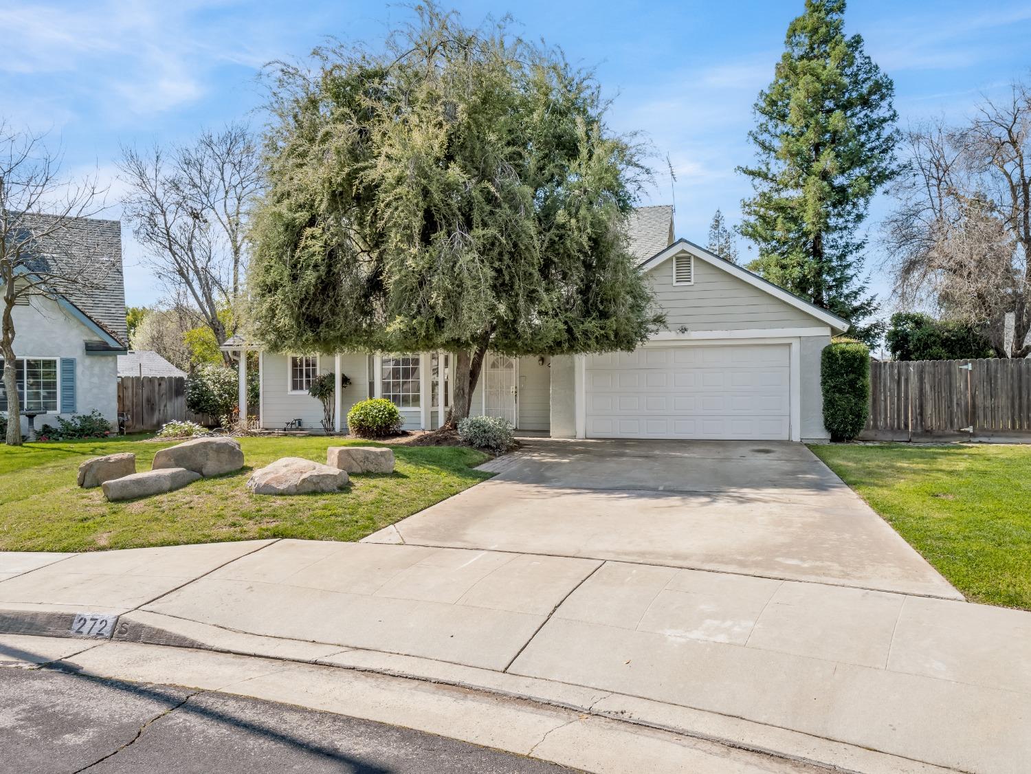 272 North Caesar Avenue Clovis, CA 93612 - Photo 2 of 34 a front view of a house with a yard and garage