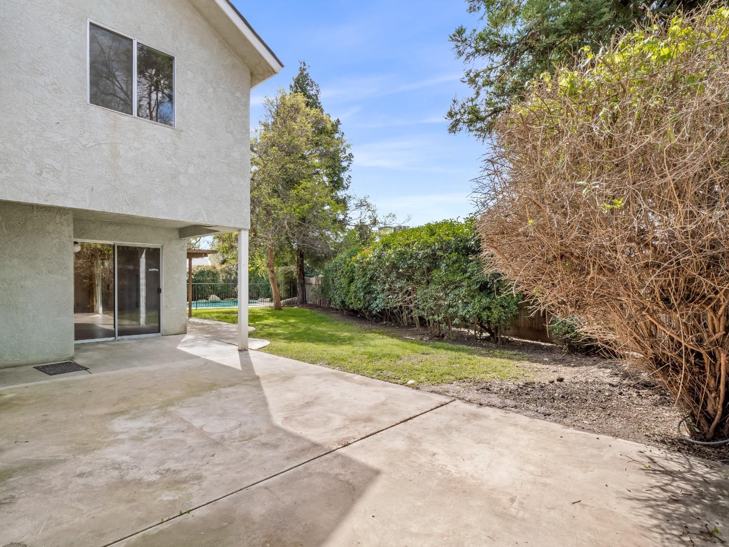 272 North Caesar Avenue Clovis, CA 93612 - Photo 27 of 34 a view of a house with backyard and trees