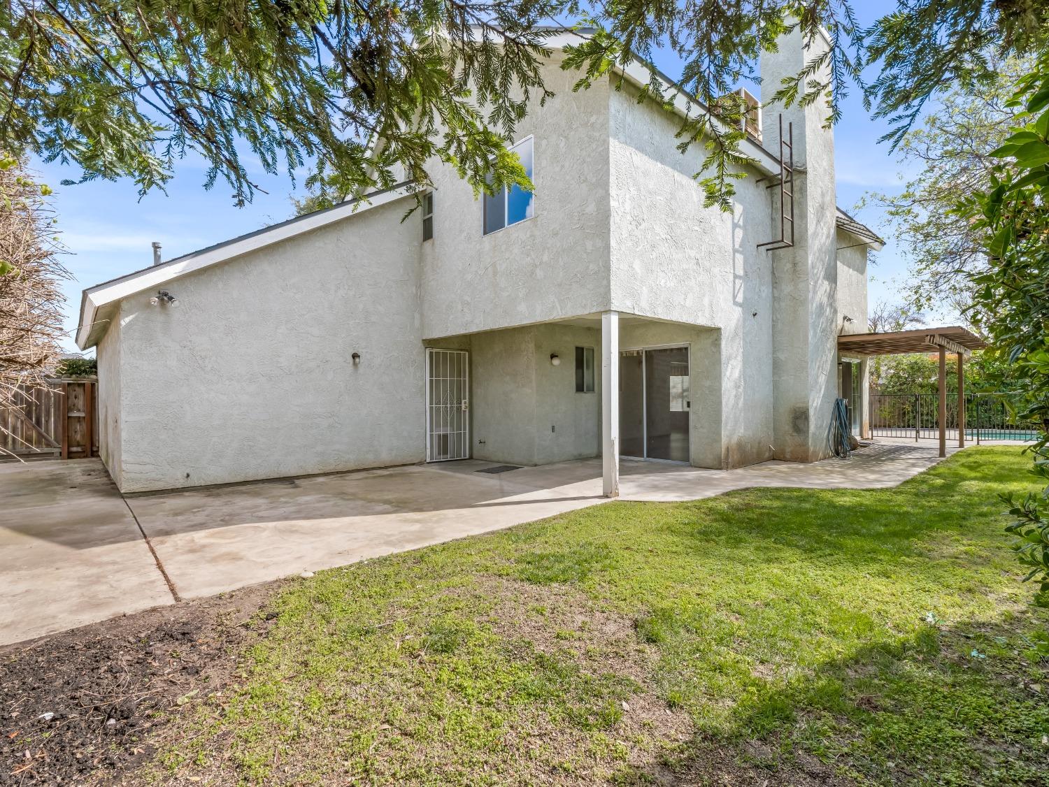 272 North Caesar Avenue Clovis, CA 93612 - Photo 28 of 34 a view of a house with a yard and garage