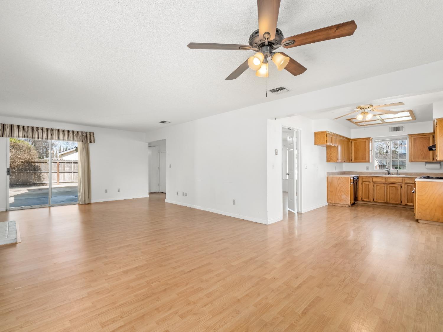 272 North Caesar Avenue Clovis, CA 93612 - Photo 9 of 34 a view of empty room with wooden floor and fan