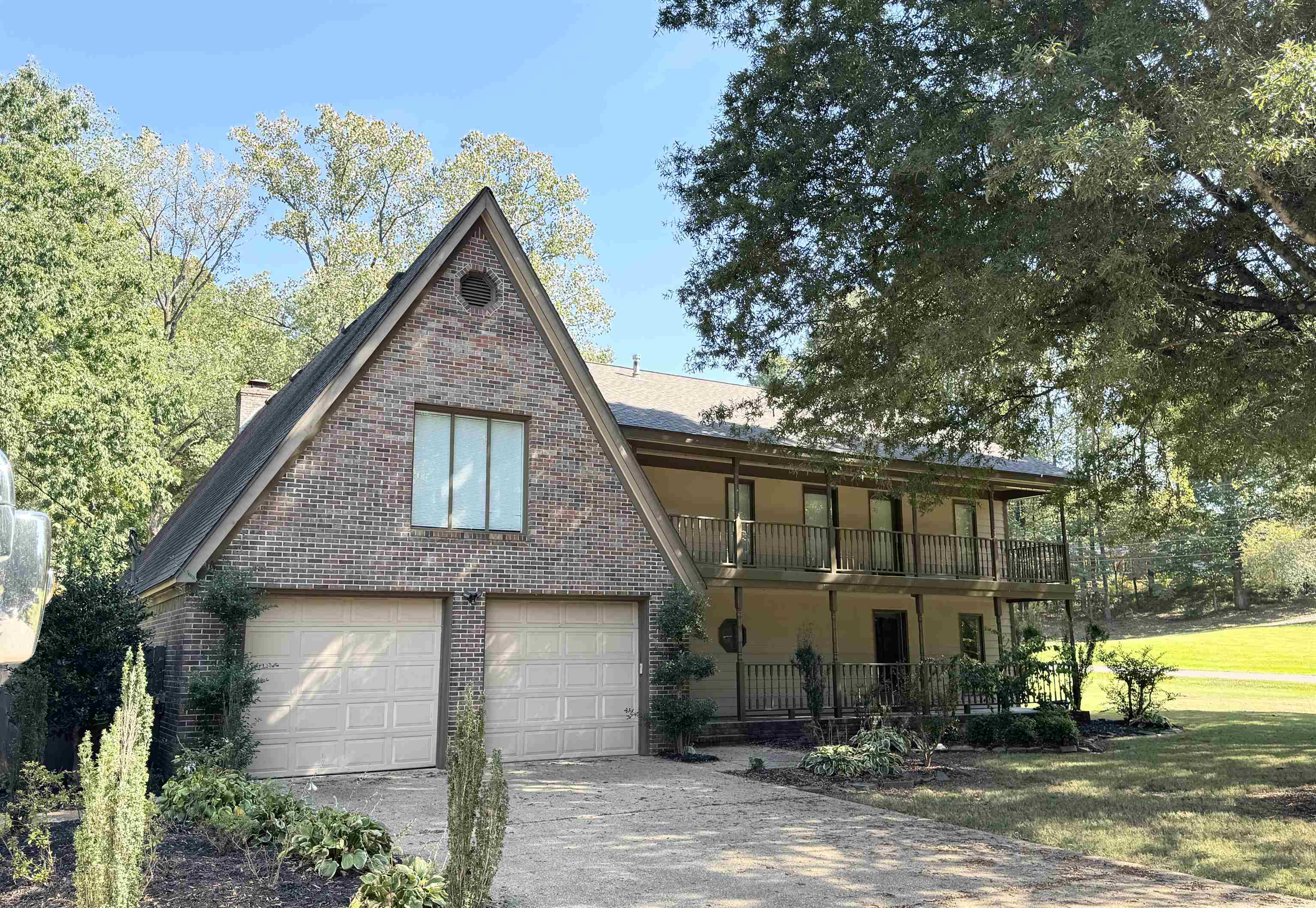 a view of a house with brick walls