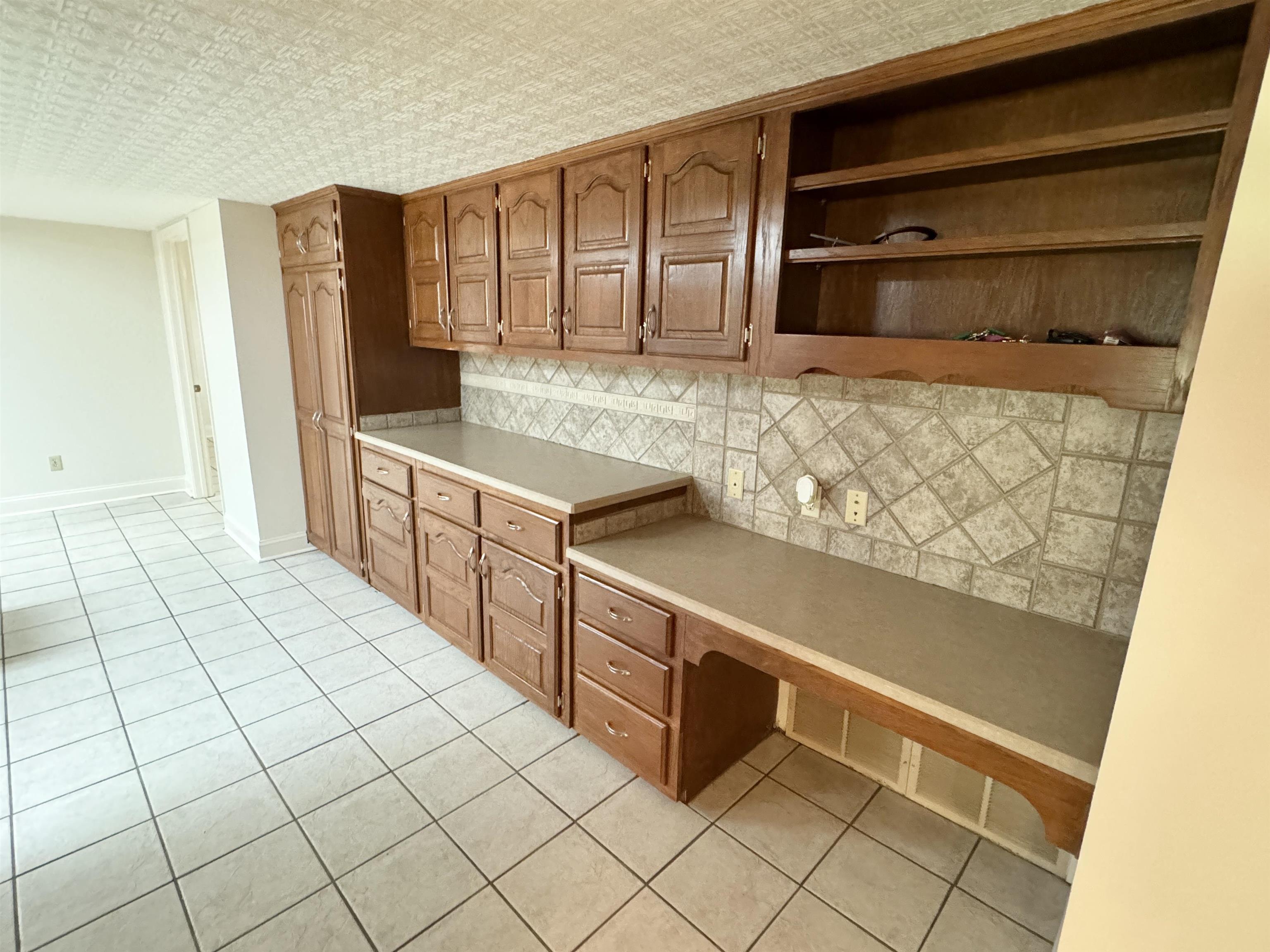 20 Tonya Drive Ripley, TN 38063 - Photo 12 of 33 a kitchen with stainless steel appliances cabinets and wooden floor