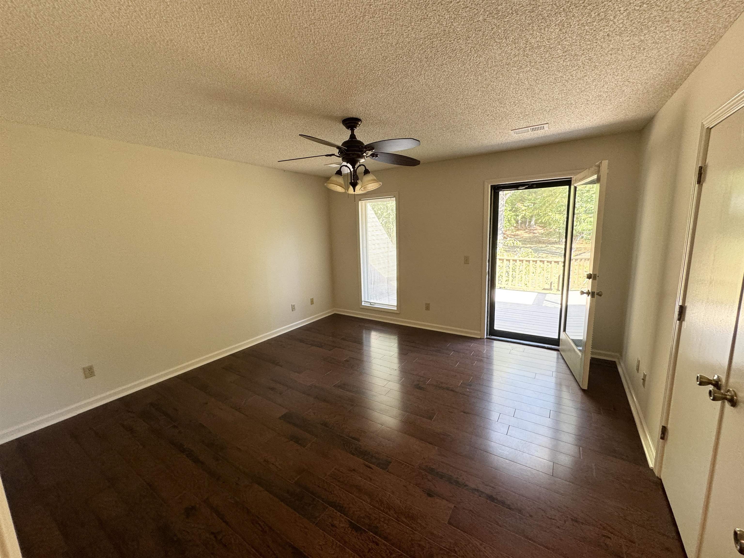 20 Tonya Drive Ripley, TN 38063 - Photo 16 of 33 an empty room with wooden floor and windows