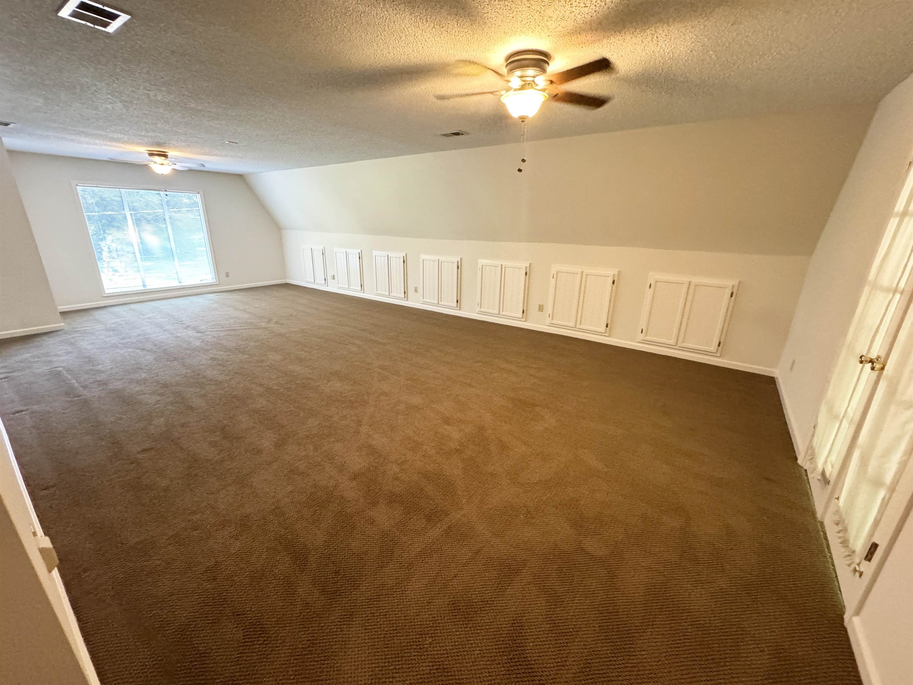 20 Tonya Drive Ripley, TN 38063 - Photo 18 of 33 wooden floor in an empty room with a window