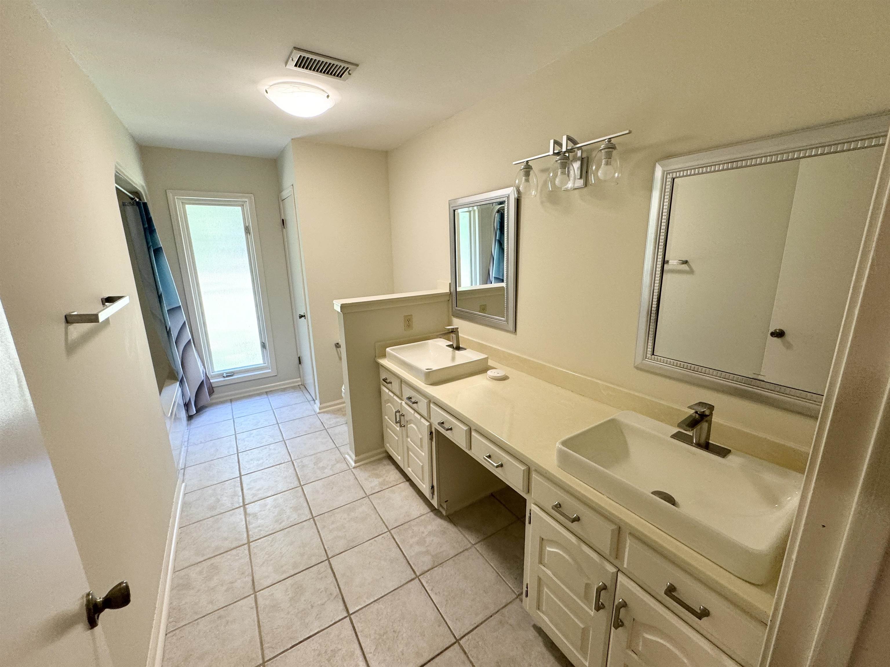 20 Tonya Drive Ripley, TN 38063 - Photo 22 of 33 a spacious bathroom with a sink a mirror and a shower