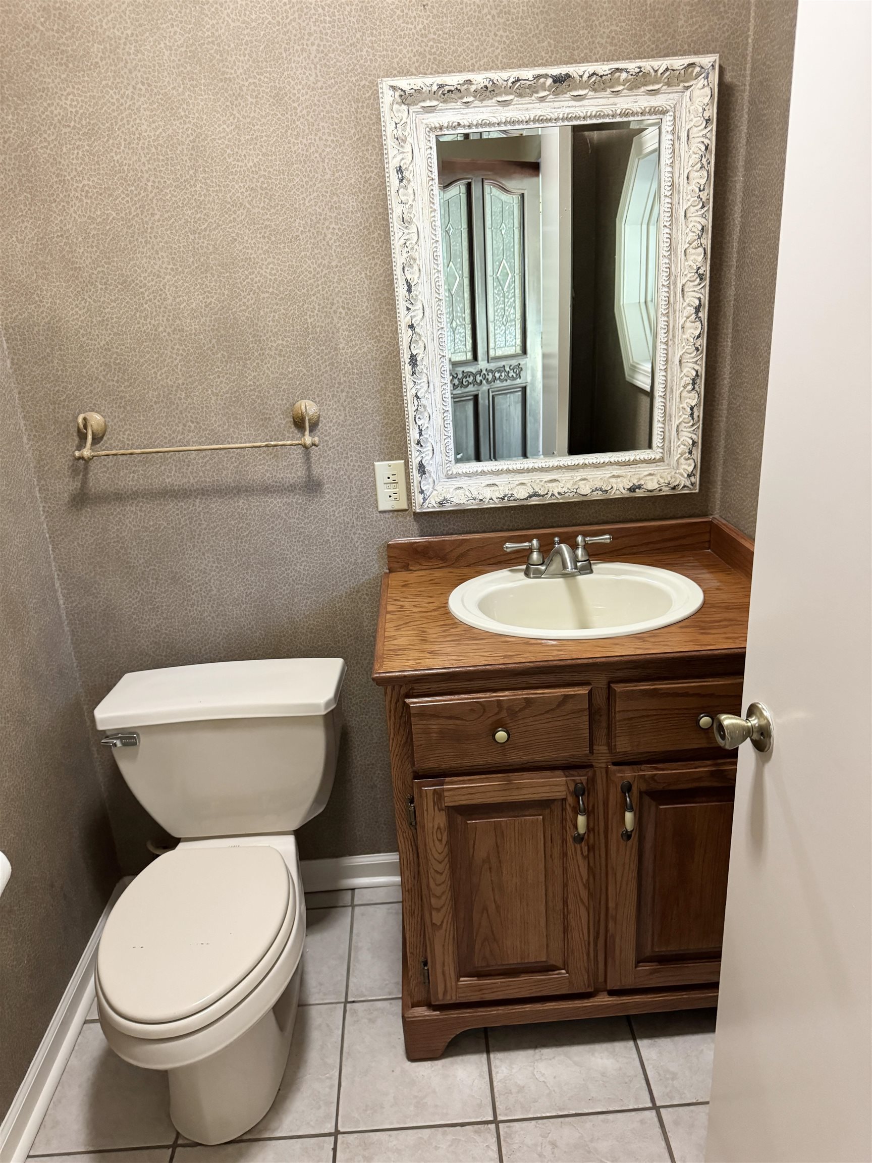 20 Tonya Drive Ripley, TN 38063 - Photo 25 of 33 a bathroom with a toilet sink and mirror
