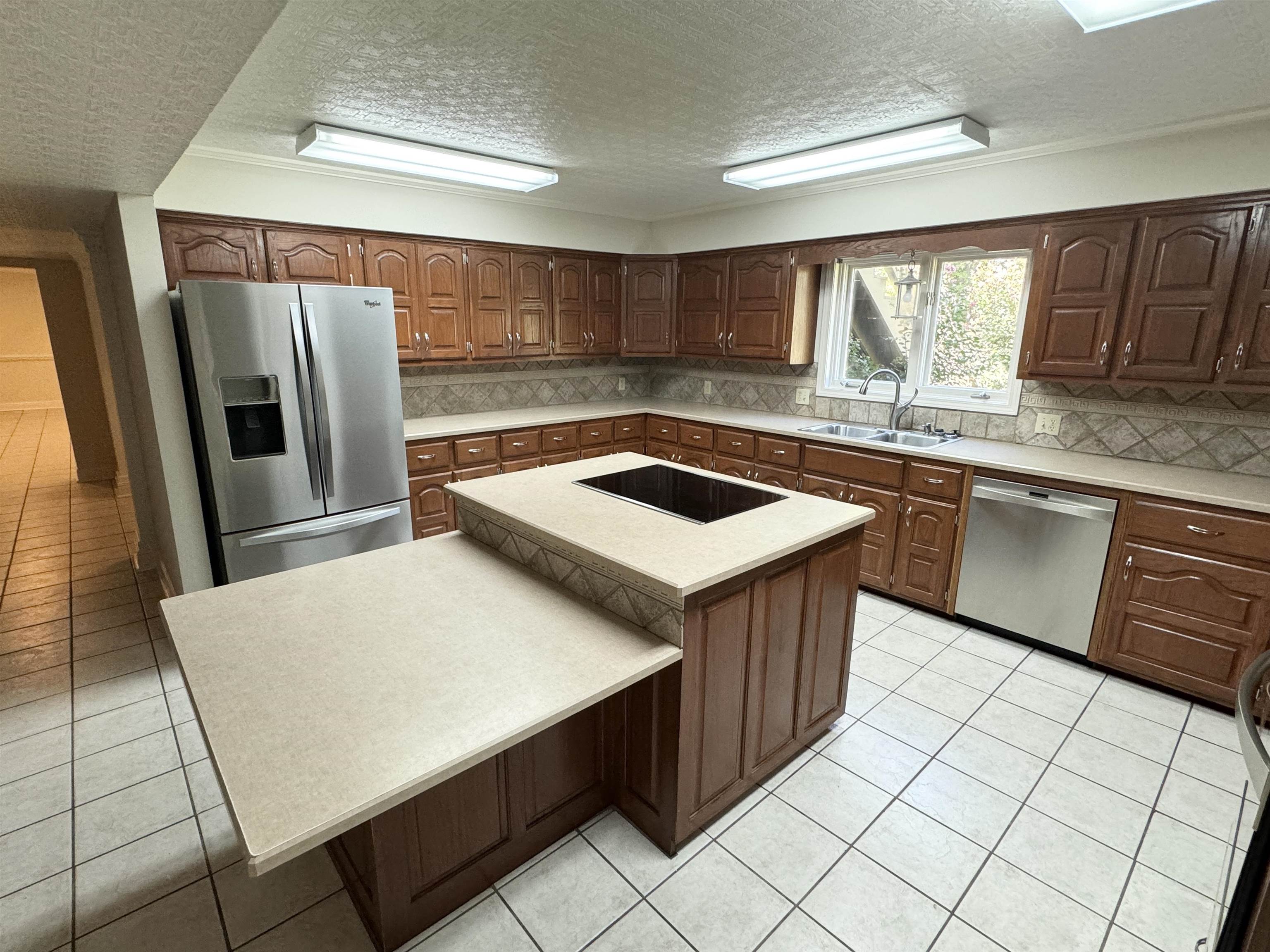 20 Tonya Drive Ripley, TN 38063 - Photo 7 of 33 a kitchen with stainless steel appliances granite countertop a sink counter space and a window