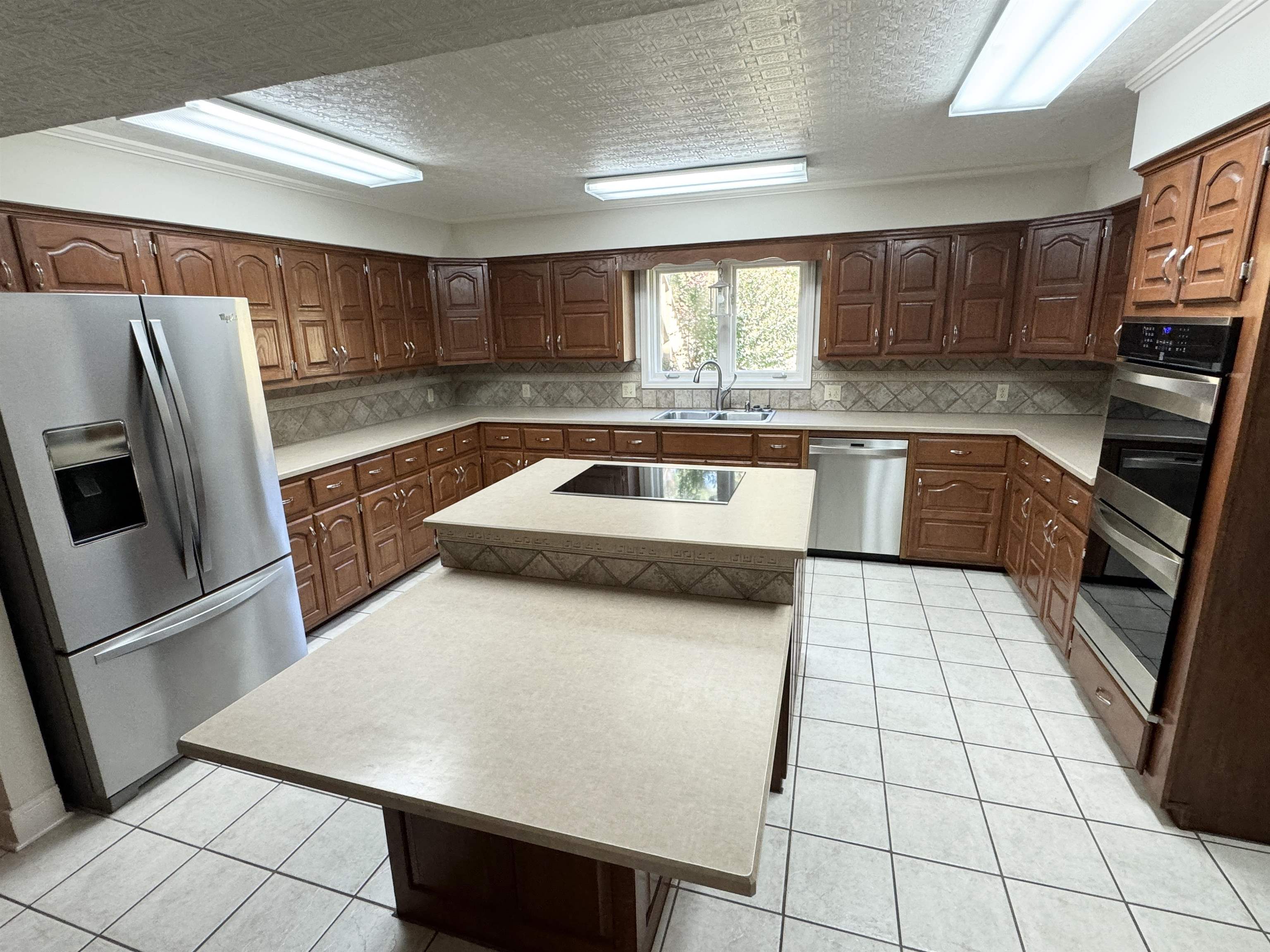 20 Tonya Drive Ripley, TN 38063 - Photo 10 of 33 a kitchen with stainless steel appliances a refrigerator sink and microwave