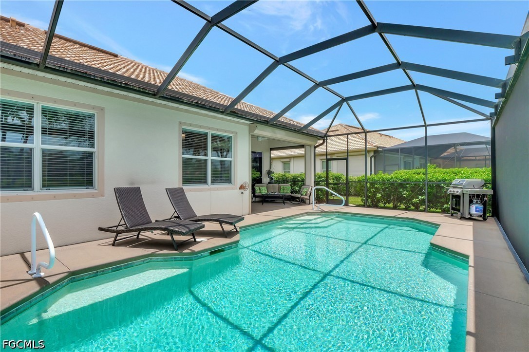 11230 Suffield Street Fort Myers, FL 33913 - Photo 24 of 42 a view of a backyard with sitting area and garden