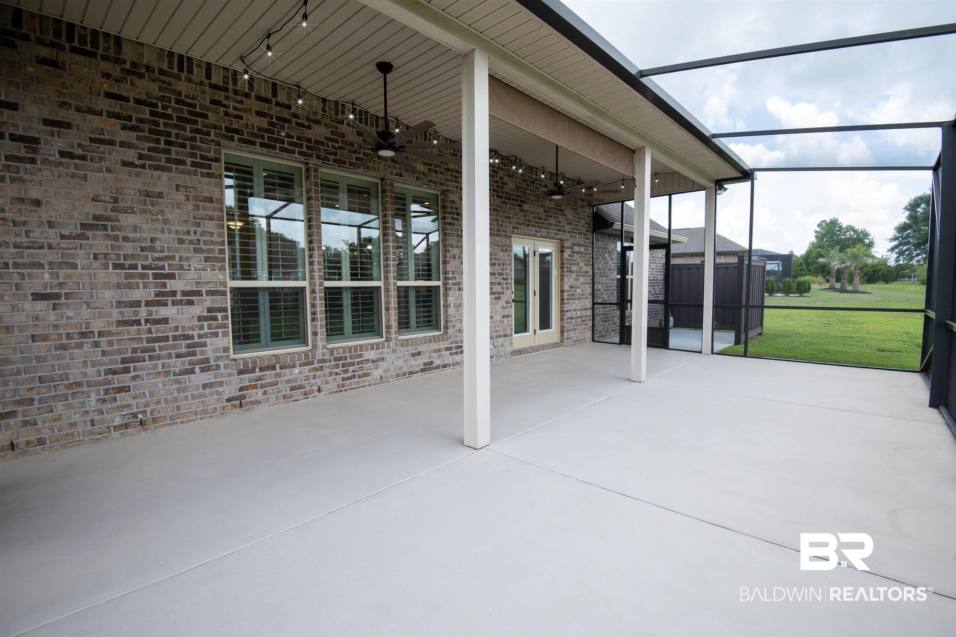 9843 Chipper Lane Foley, AL 36535 - Photo 31 of 34 View of patio / terrace with ceiling fan and a lanai