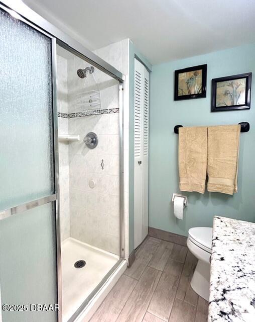 1415 Ocean Shore Drive, Unit 1011 Ormond Beach, FL 32176 - Photo 19 of 20 a bathroom with a shower and a toilet