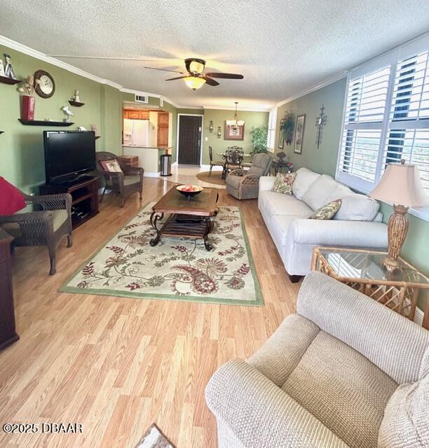 1415 Ocean Shore Drive, Unit 1011 Ormond Beach, FL 32176 - Photo 7 of 20 a living room with furniture and a flat screen tv