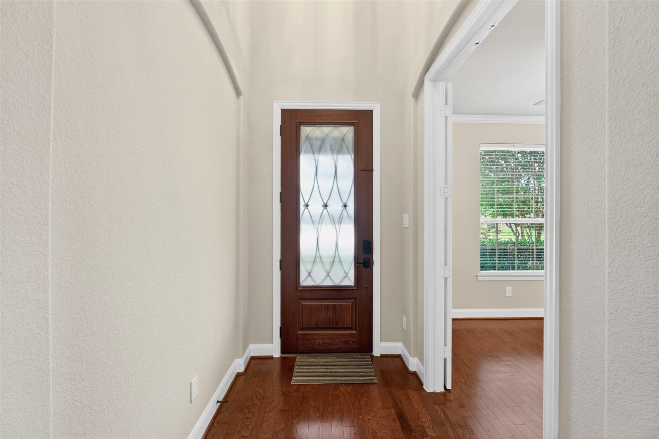 18202 Wedgewood Bluff Court Spring, TX 77379 - Photo 11 of 50 Bright entry foyer with wood flooring and natural light from the front door.