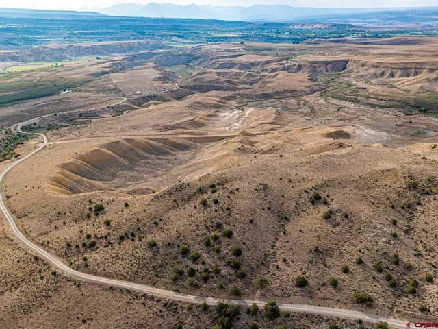 a view of beach and small yard