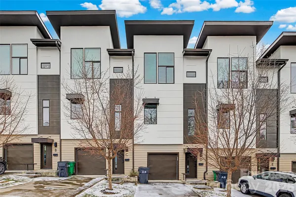 a front view of a building with a road