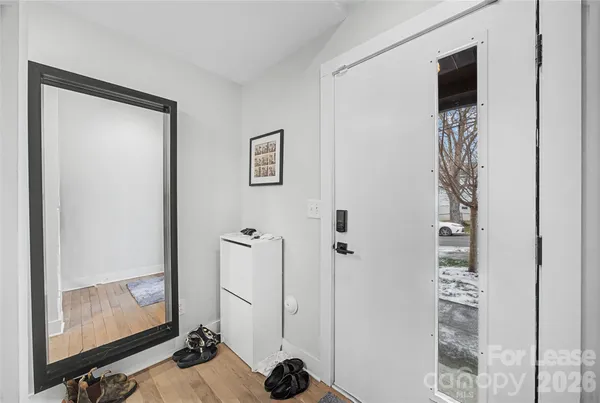 a view of a hallway with front door