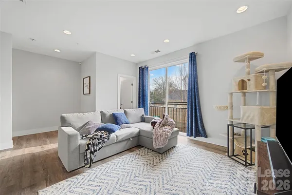 a living room with furniture and a floor to ceiling fan