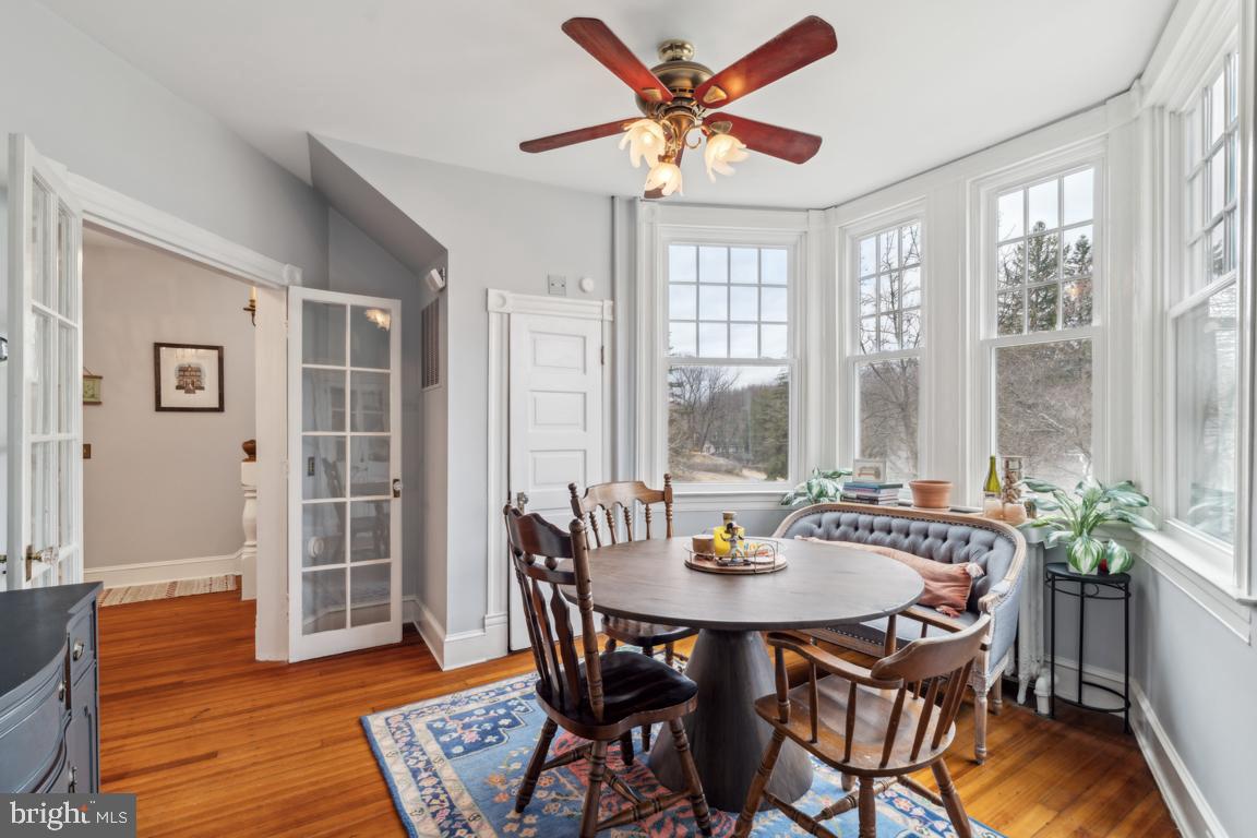 1811 Dixon Road Baltimore, MD 21209 - Photo 11 of 45 a view of a dining room with furniture window and wooden floor