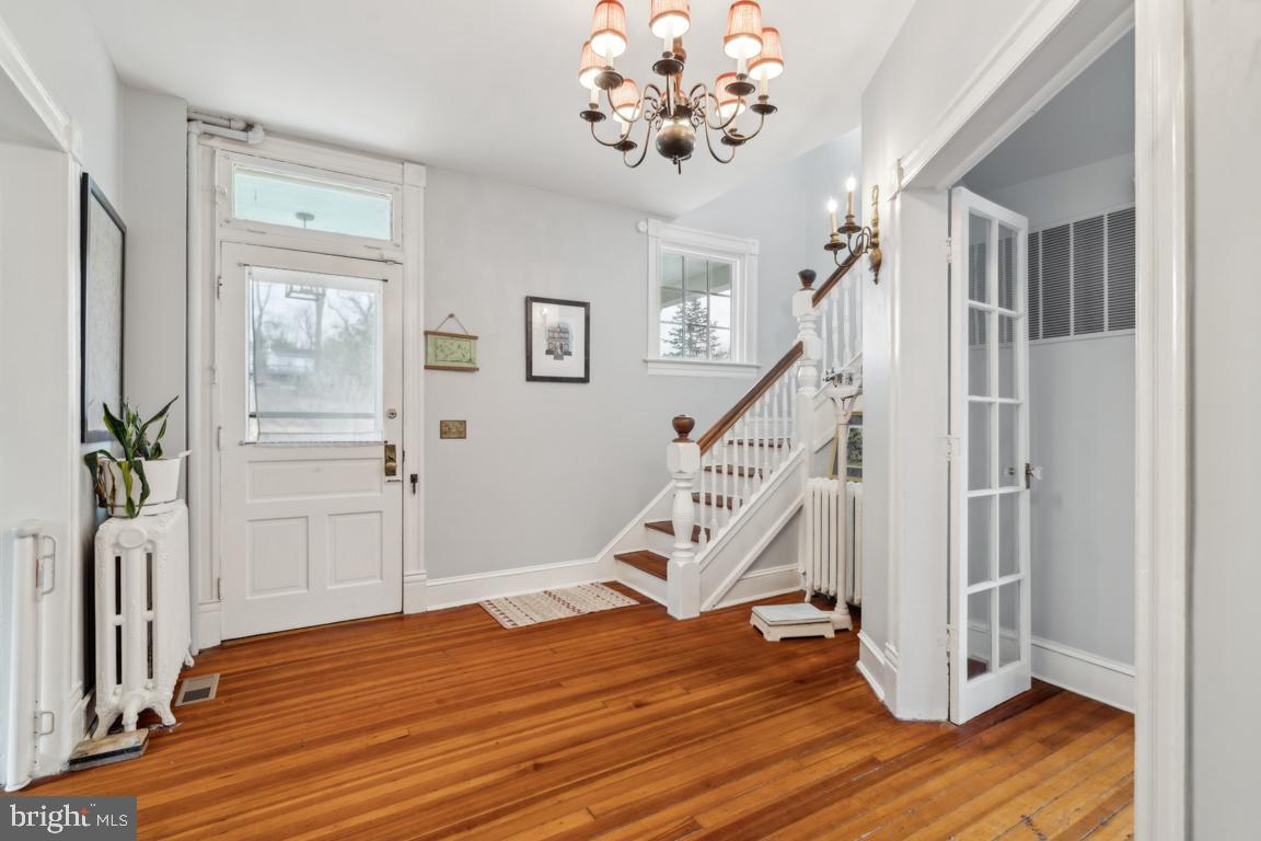 1811 Dixon Road Baltimore, MD 21209 - Photo 9 of 45 a view of an entryway with wooden floor and staircase