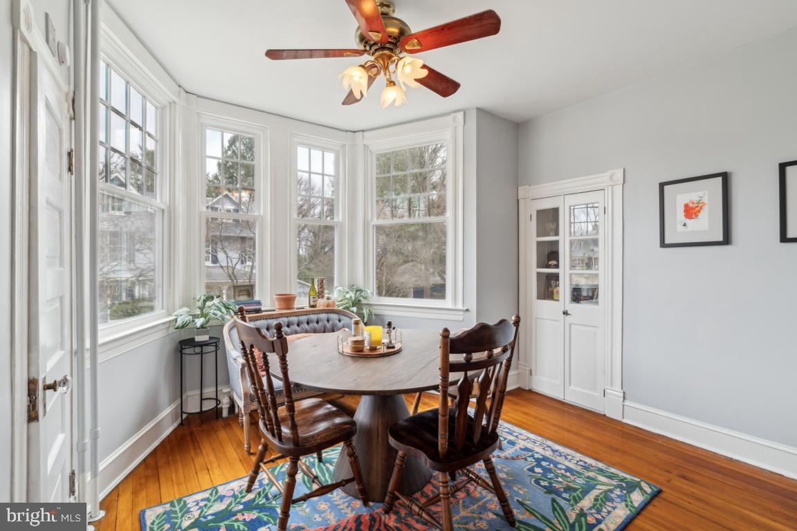 1811 Dixon Road Baltimore, MD 21209 - Photo 10 of 45 a view of a dining room with furniture window and wooden floor