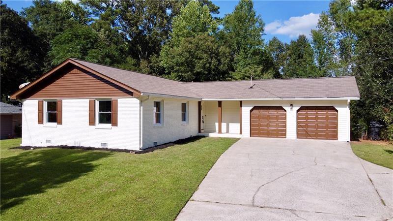 a front view of a house with yard