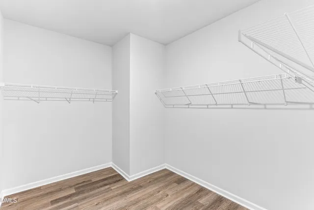 a view of a livingroom with wooden floor