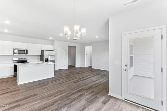 a view of kitchen with wooden floor