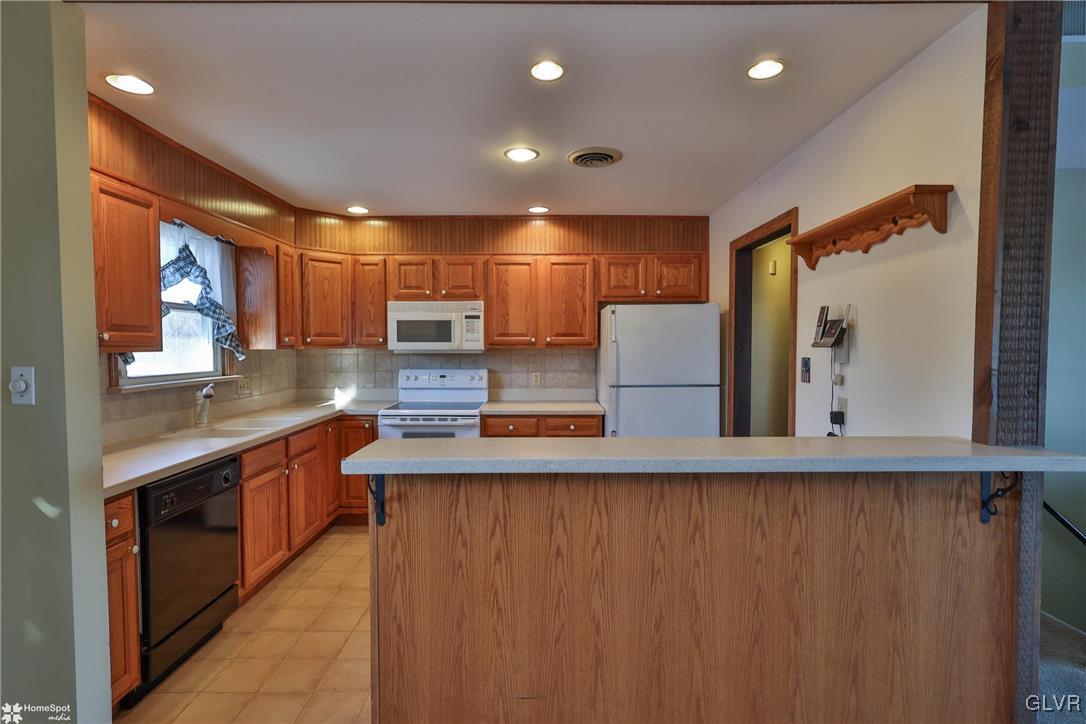 2629 Beacon Road Bath, PA 18014 - Photo 12 of 40 a kitchen with stainless steel appliances granite countertop a sink and a refrigerator