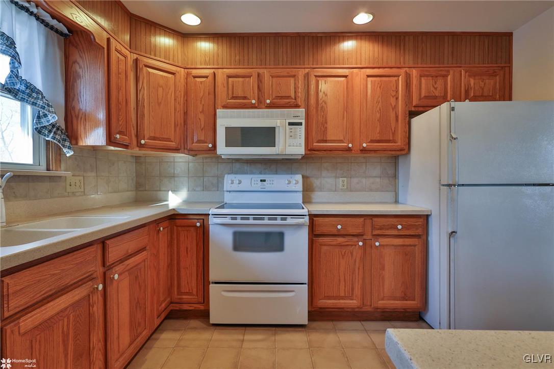 2629 Beacon Road Bath, PA 18014 - Photo 13 of 40 a kitchen with stainless steel appliances granite countertop a refrigerator and a sink