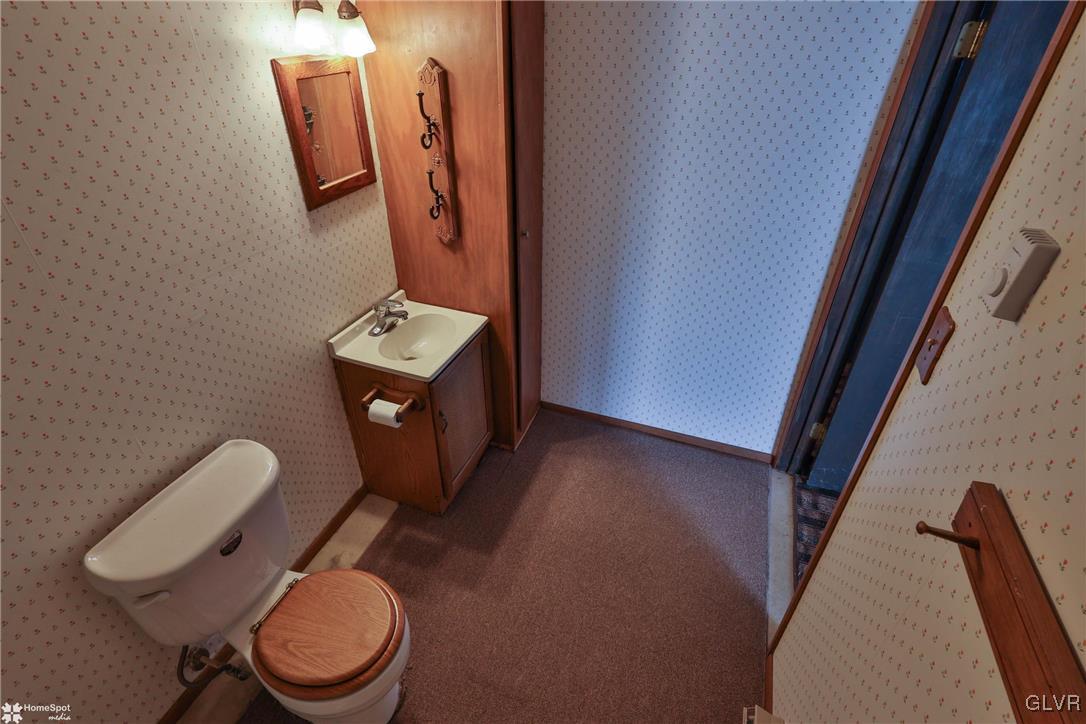 2629 Beacon Road Bath, PA 18014 - Photo 30 of 40 a bathroom with a toilet sink and mirror