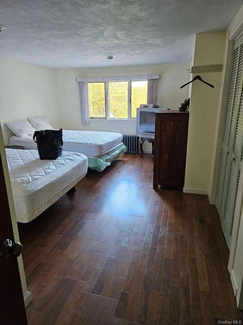 226 Park Road Johnsburg, NY 12843 - Photo 6 of 10 a living room with furniture and a wooden floor