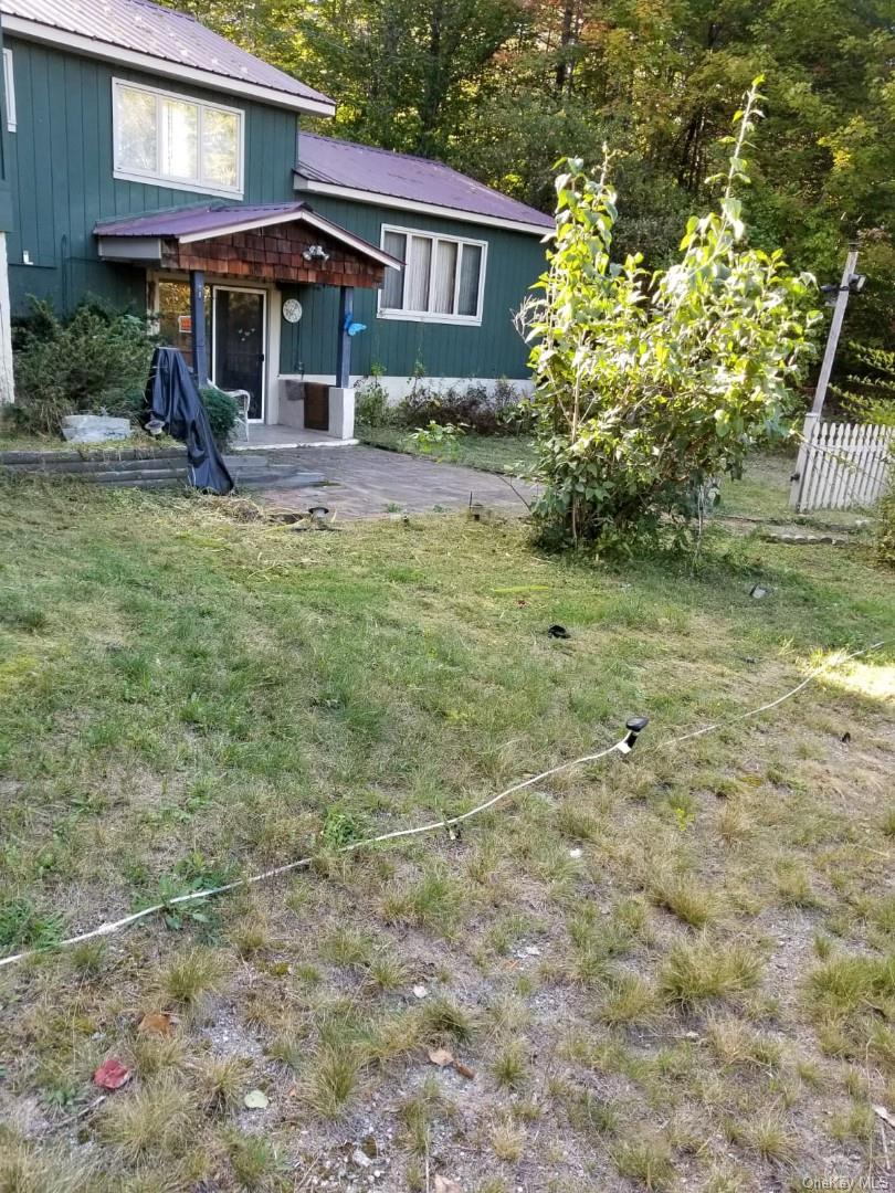 226 Park Road Johnsburg, NY 12843 - Photo 10 of 10 a front view of a house with garden