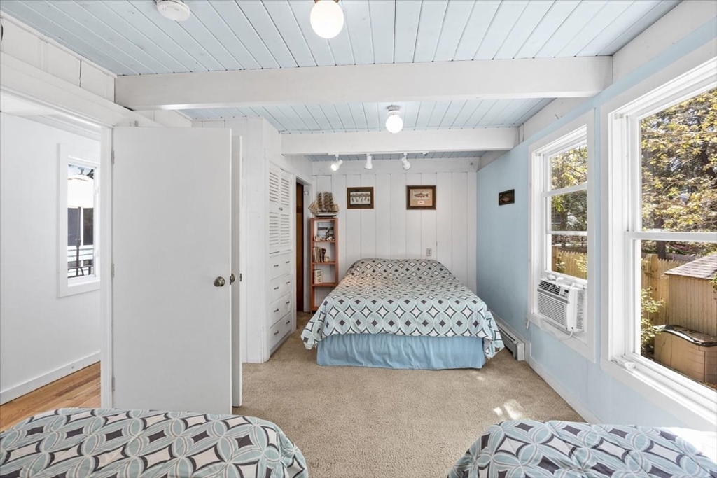 35 Tecumseh Road Wellfleet, MA 02667 - Photo 14 of 24 a bedroom with a large bed and a window